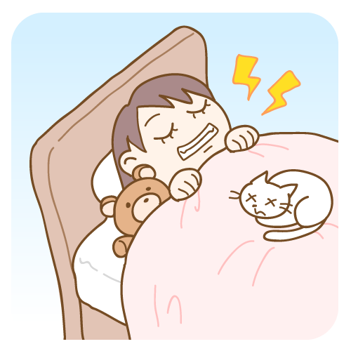寝ながら歯ぎしりをする子供の画像
